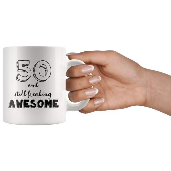 https://www.cosless.com/cdn/shop/products/50-and-still-freaking-awesome-50th-birthday-coffee-mug-great-gift-for-men-and-women-celebrating-50-years-old-birthday-749294_600x.png?v=1620030180